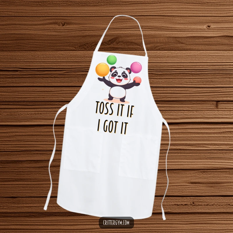 Funny apron showing a cheerful panda bear gleefully juggling oversized yoga balls while cooking, a humorous kitchen accessory.