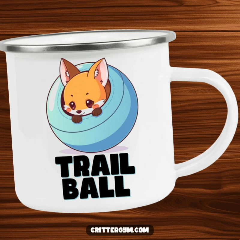 Funny enamel camping mug with a curious fox peeking from behind a colorful exercise ball, perfect for camping trips.