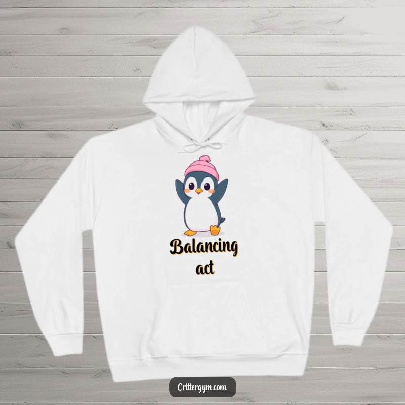 Funny hoodie featuring a silly penguin character attempting a handstand with surprised concentration, perfect for cozy humor.