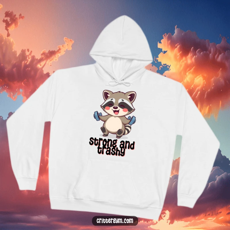 Funny Kawaii raccoon character giggling while lifting small barbells, printed on a cozy hoodie for humorous workouts.