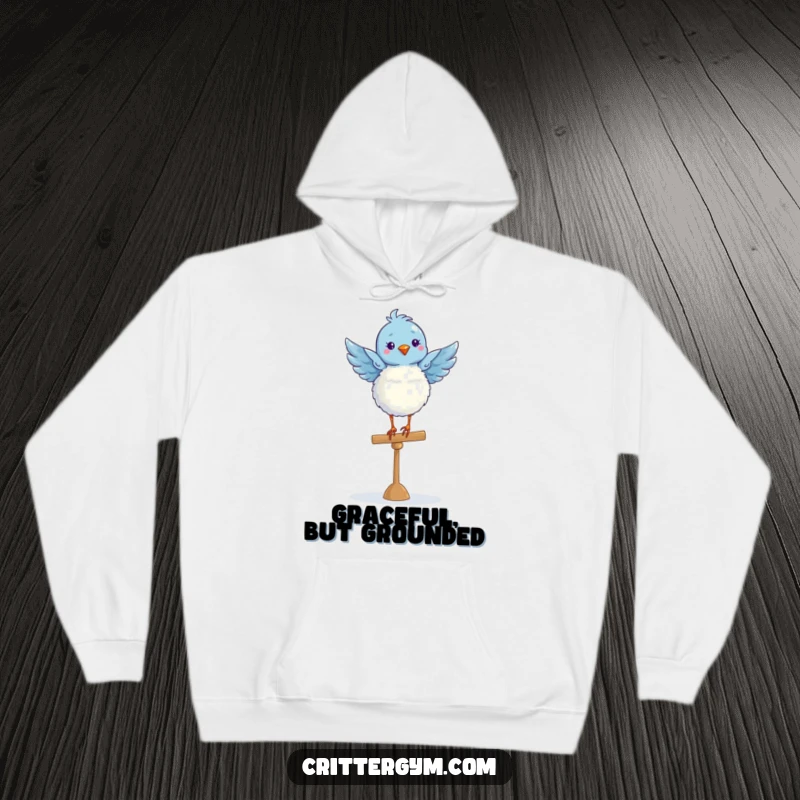 Funny fluffy blue bird in a graceful ballet pose on a balance beam, captured on a cozy hoodie.