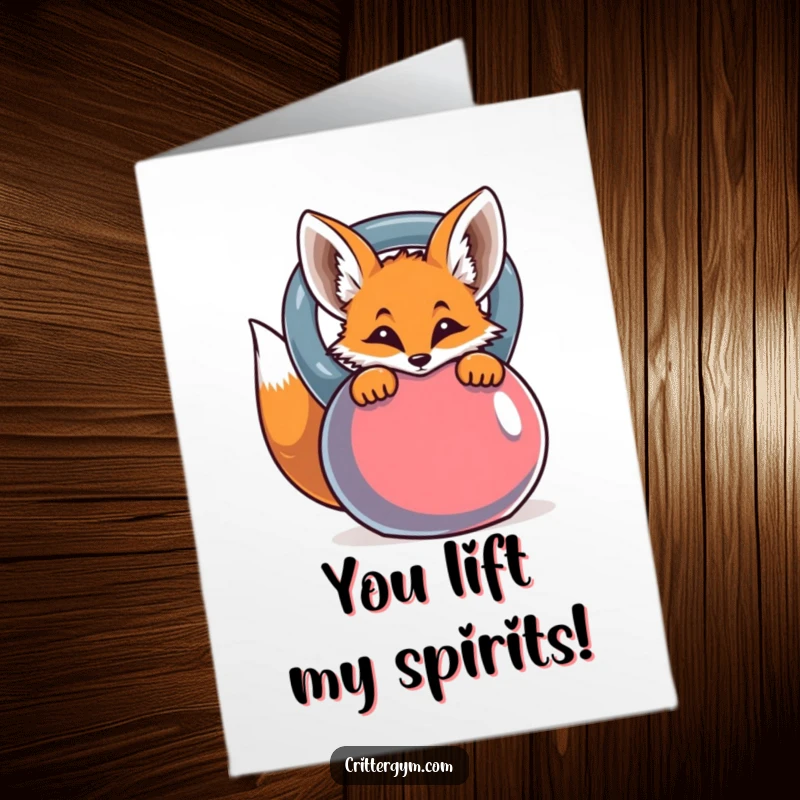 Funny Free Printable Congratulations Card: A curious fox peers from behind a large kettlebell, celebrating your success.